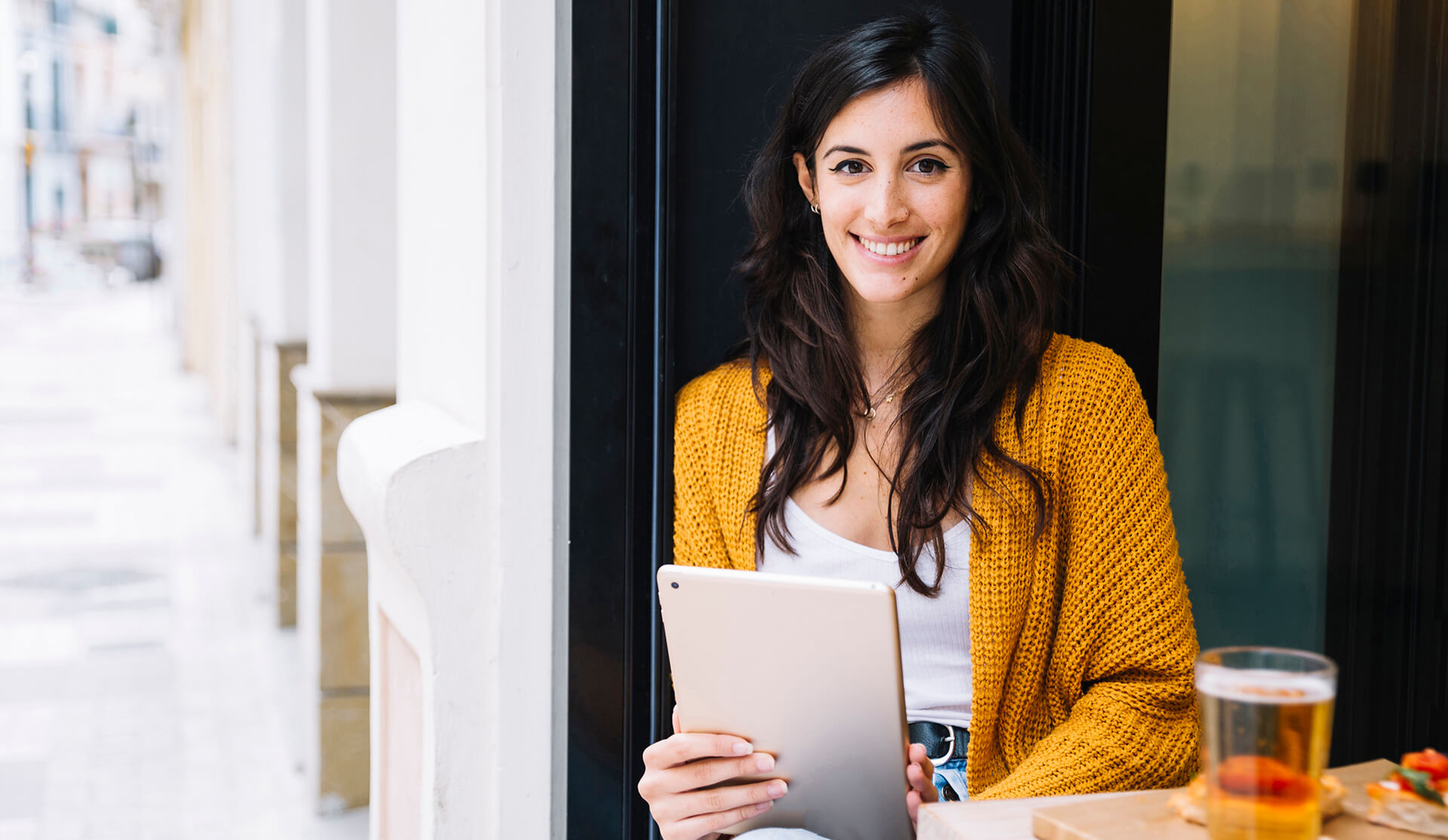 Women page. Hispanic woman. Page woman. Not confident girl. Young woman Relaxed at Heater with Tablet in hand.